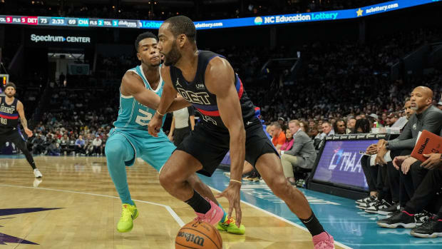 Oct 27, 2023; Charlotte, North Carolina, USA; Detroit Pistons guard Alec Burks (14) dribbles past Charlotte Hornets forward Brandon Miller (24) during the second half at Spectrum Center.